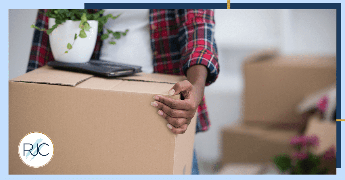 person holding a moving box