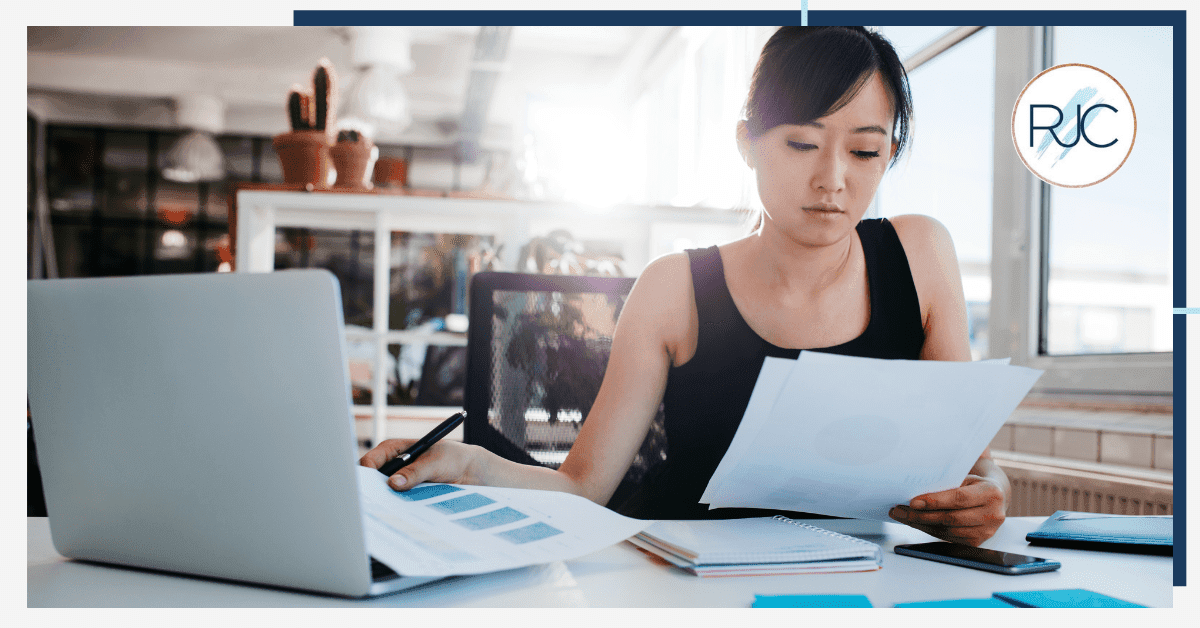 woman looking at paper