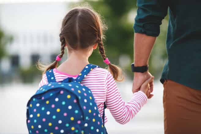 daughter holding her dad's hand